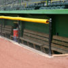 Yellow Ply-cap used on a dugout fence