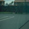 Douglas Divider Curtains installed in an outdoor tennis court facility