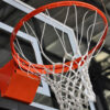 Orange basketball hoop with white net attached to a backboard, seen from below.