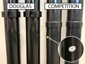 Newsfeed-Premier-XS-Comparison-2 - Douglas Sports Equipment Side-by-side comparison of two black cylindrical shafts labeled DOUGLAS (left) and COMPETITION (right); a close-up in the right tube shows a small white sticker reading MADE IN CHINA.